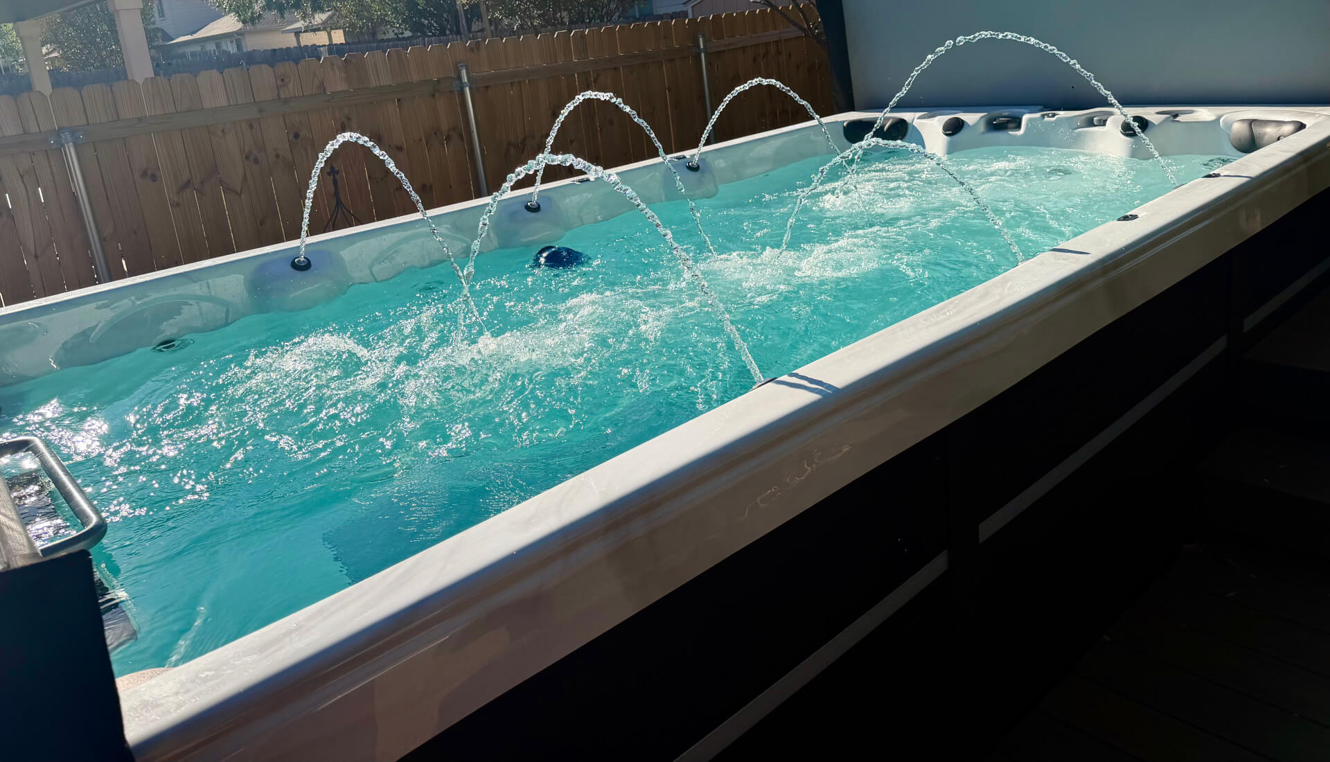 Swim spa with water features running